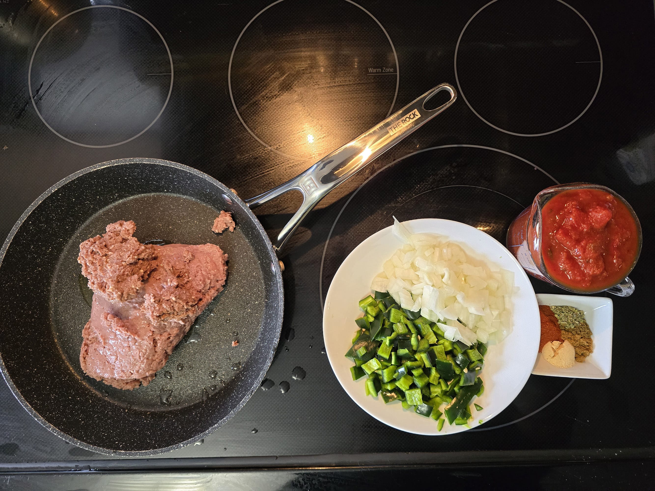All of the recipe ingredients prepared and arranged on a stove top.