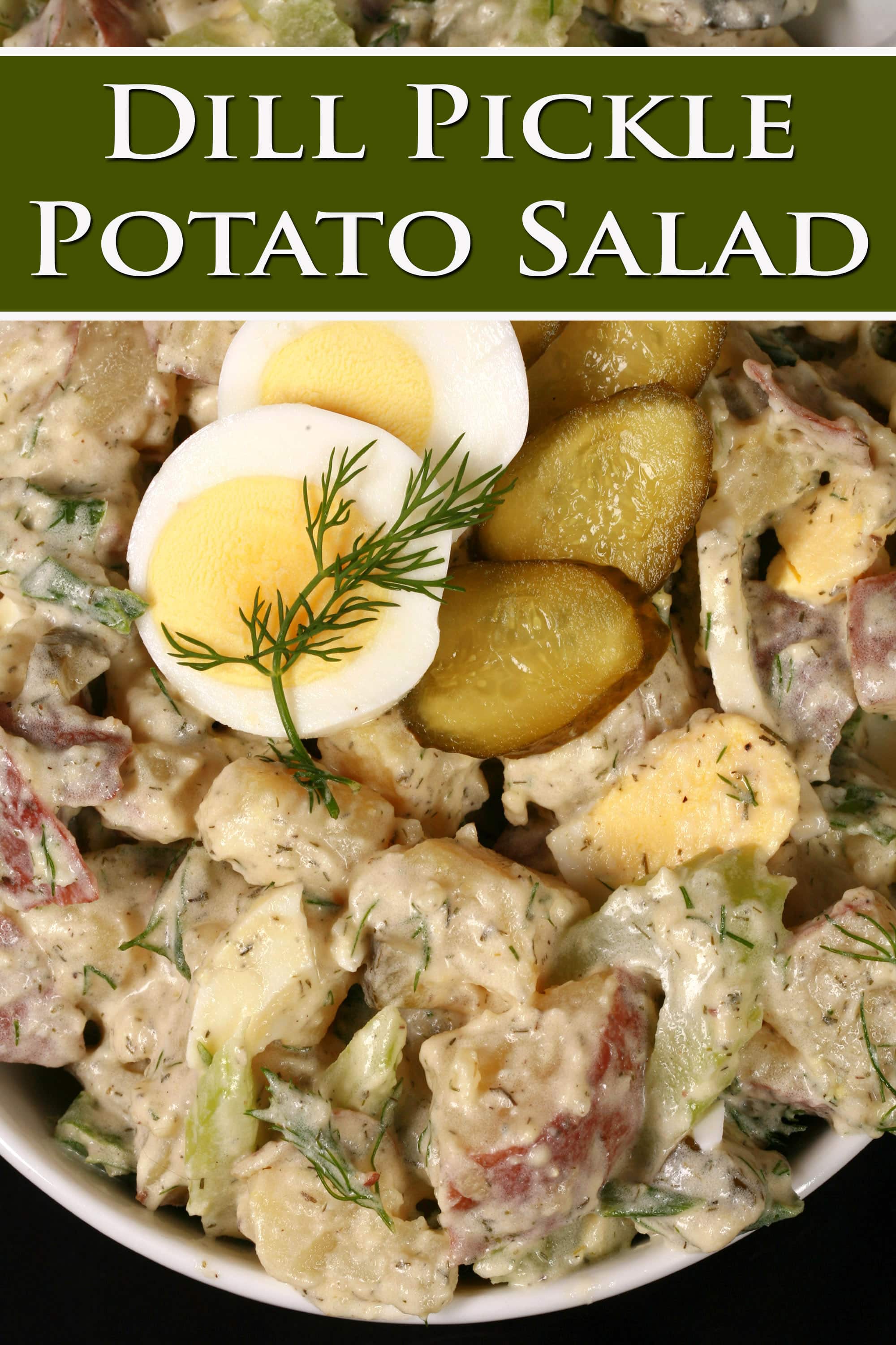 A serving bowl of potato salad with pickles, boiled eggs, celery, and dill. Overlaid text says dill pickle potato salad.
