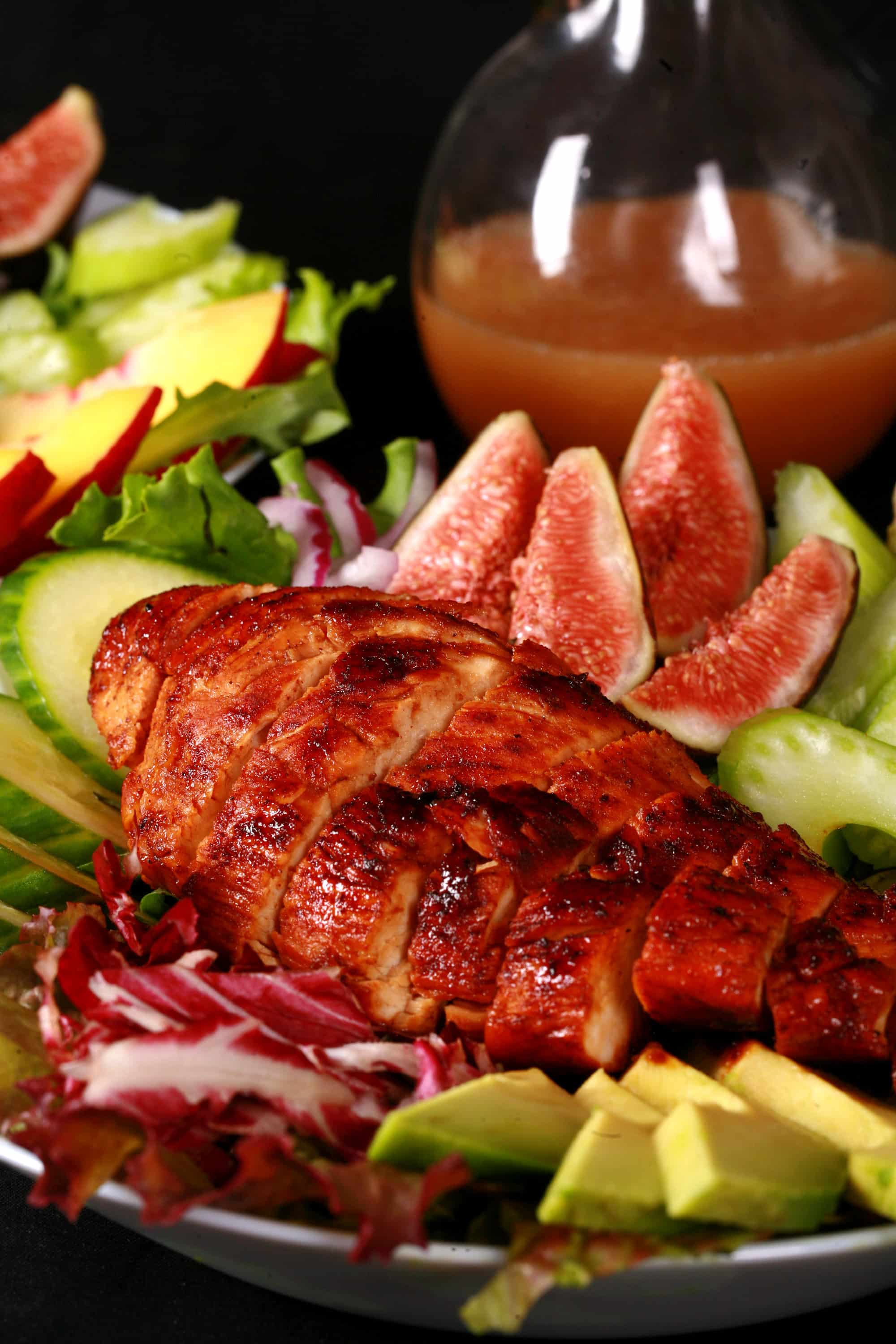 2 summer salads with peaches, figs, avocado, vegetables, and white peach balsamic vinegar glazed chicken breast.