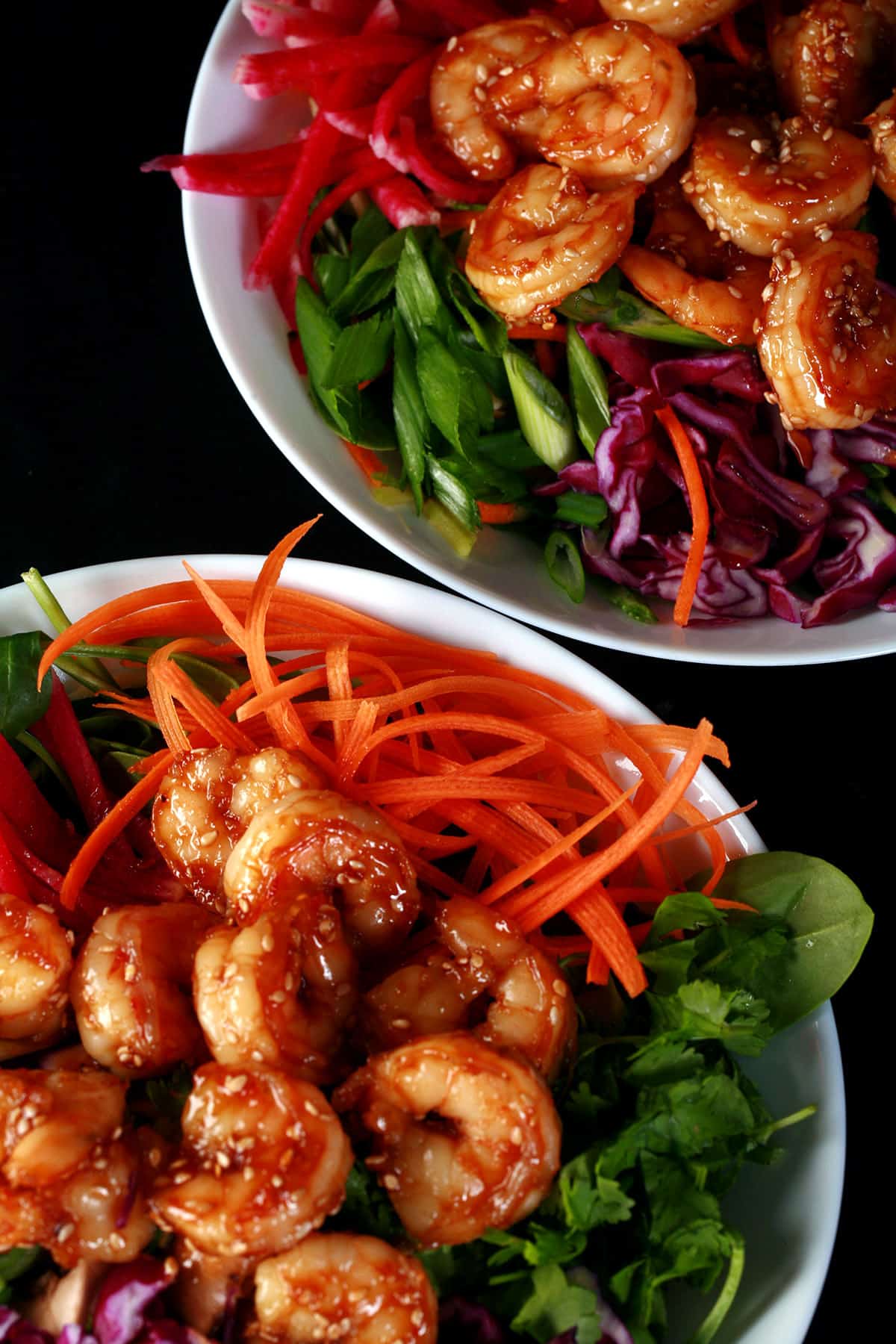 2 Honey ginger shrimp salads with a bottle of honey ginger vinaigrette.