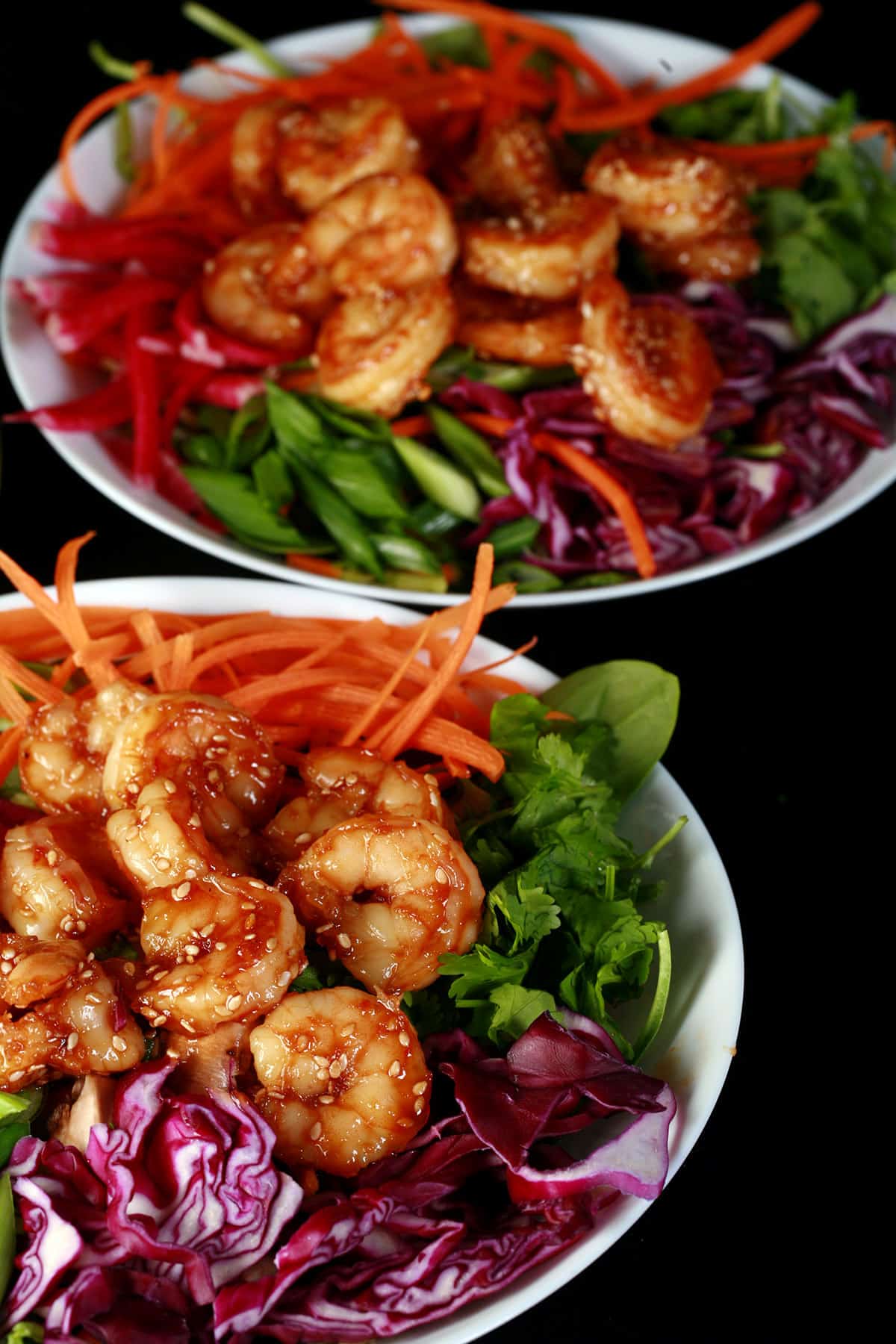 2 Honey ginger shrimp salads with a bottle of honey ginger vinaigrette.
